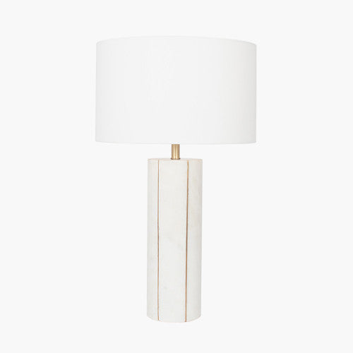 White marble table lamp with brass detail and cylinder shade